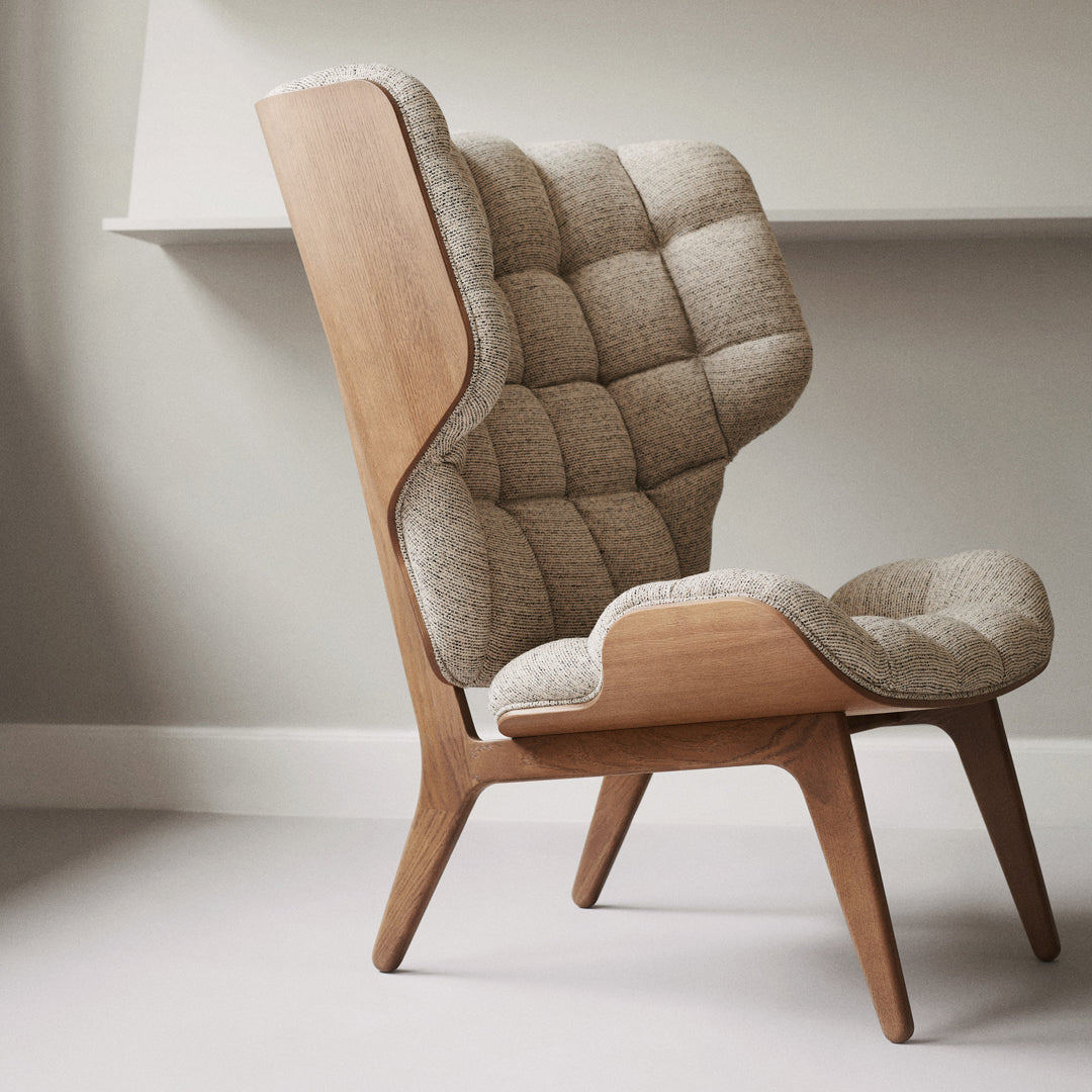 Beige tufted upholstery with wooden frame, showcasing a modern, elegant design and cozy texture.
