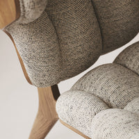 Textured beige upholstery with subtle flecks of gray, complemented by natural wood accents. Perfect for modern decor.