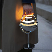 Modern metallic lamp with a sleek chrome finish and warm, glowing light pattern. Perfect for stylish illumination.