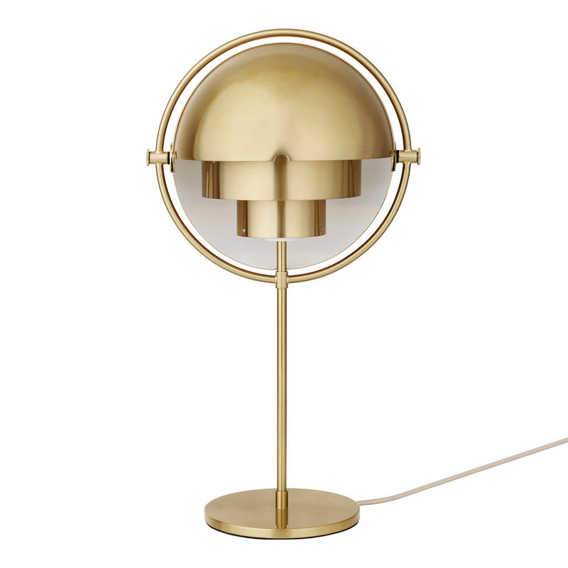 Modern brass table lamp with a sleek round shade and minimalist design. Adds elegance to any decor.