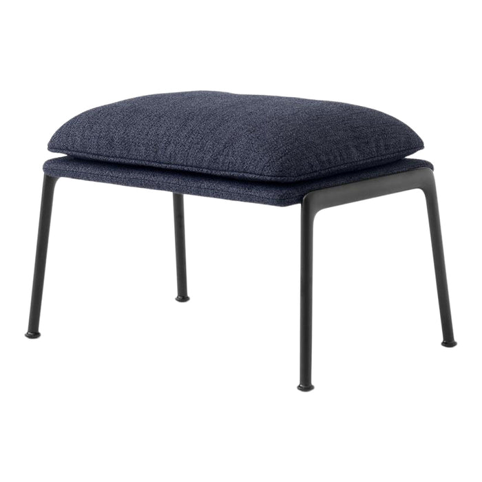 Navy blue cushioned ottoman with a textured fabric seat and sleek black metal legs. Ideal for modern decor.