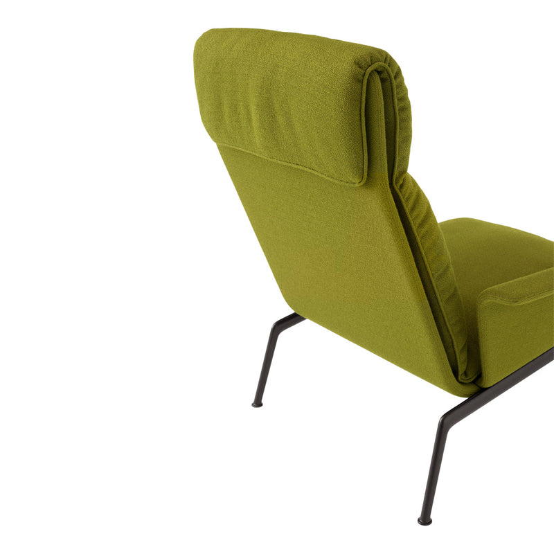 Modern green lounge chair with a sleek design and soft fabric, featuring a minimalist black metal frame.