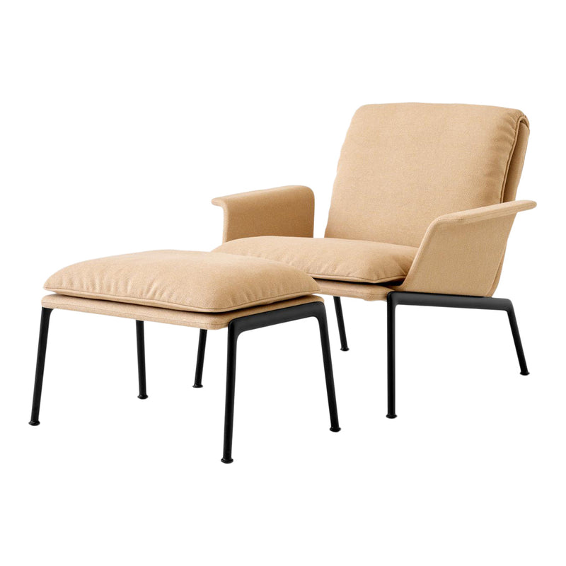 Beige upholstered chair and ottoman with black metal legs, featuring a minimalistic design and soft, textured fabric.