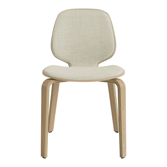 Light beige fabric chair with a smooth, minimalist design and natural wood legs, perfect for modern decor.