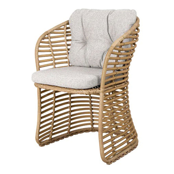 Natural rattan chair with soft gray cushion, featuring a modern woven design and stylish curved silhouette.