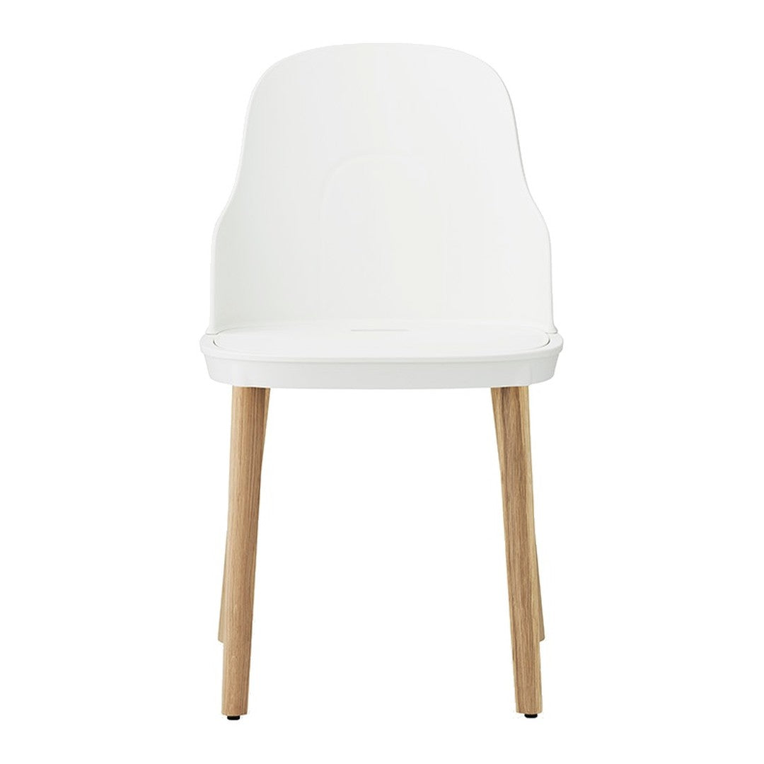 White chair with a minimalist design, featuring natural wood legs and a smooth, solid color finish.