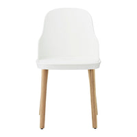 White chair with a minimalist design, featuring natural wood legs and a smooth, solid color finish.