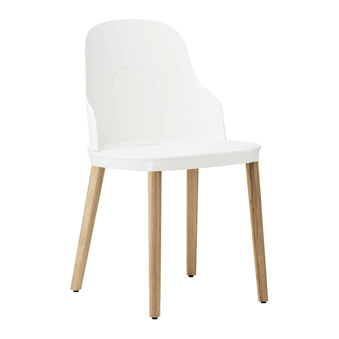 White minimalist chair with smooth curves and natural wood legs, perfect for modern interiors.