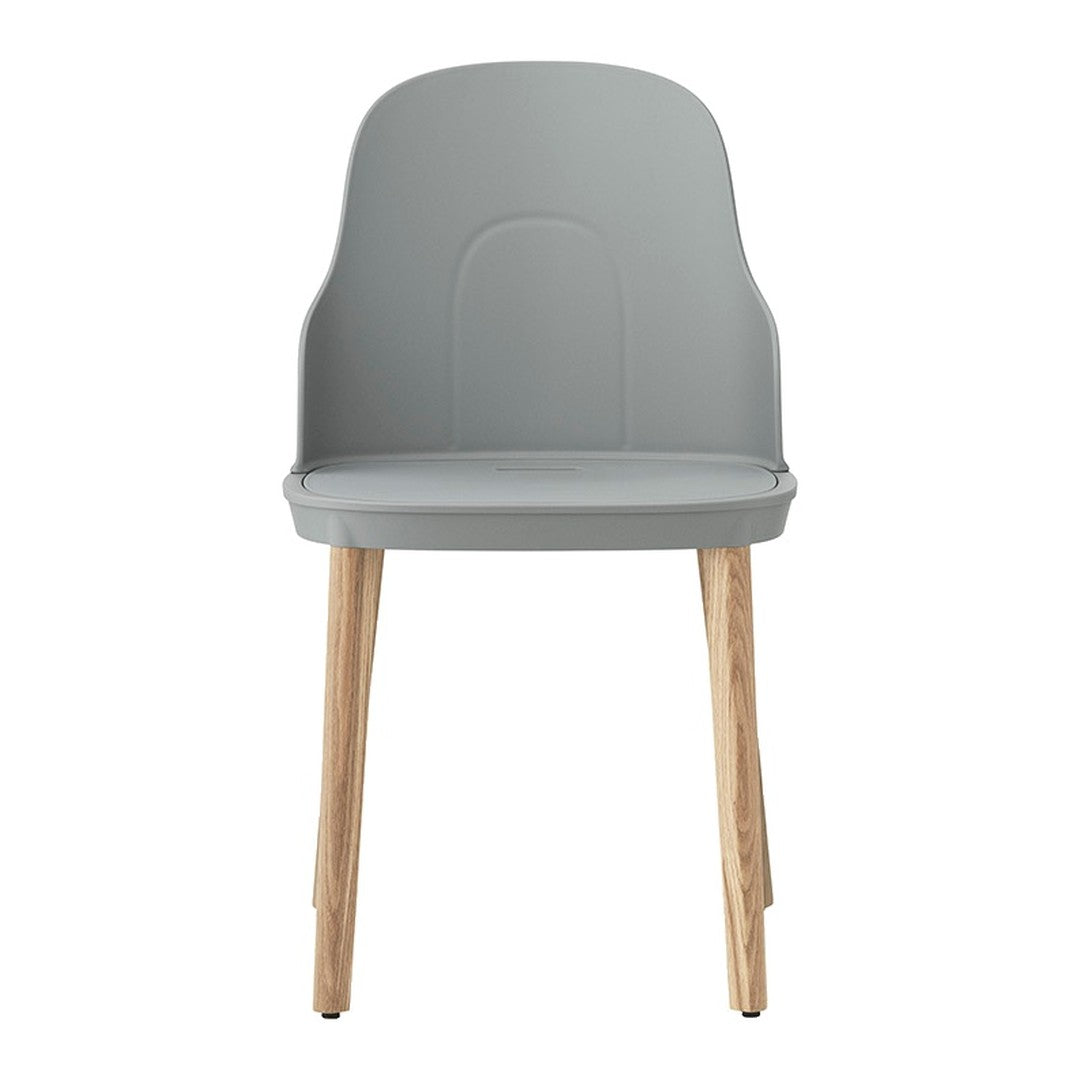 Modern gray chair with smooth, minimalist design and natural wood legs. Perfect for stylish interiors.
