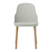 Light gray chair with a smooth finish and natural wood legs, offering a modern and minimalist look.