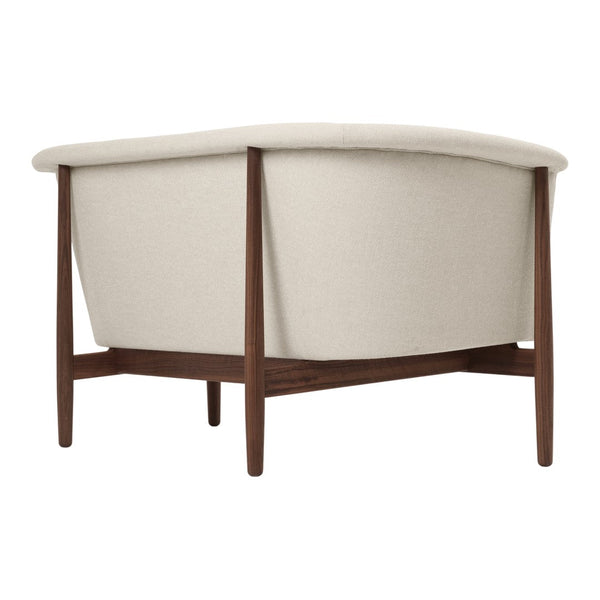 Beige upholstered chair with a curved design and brown wooden legs. Minimalist style for modern interiors.