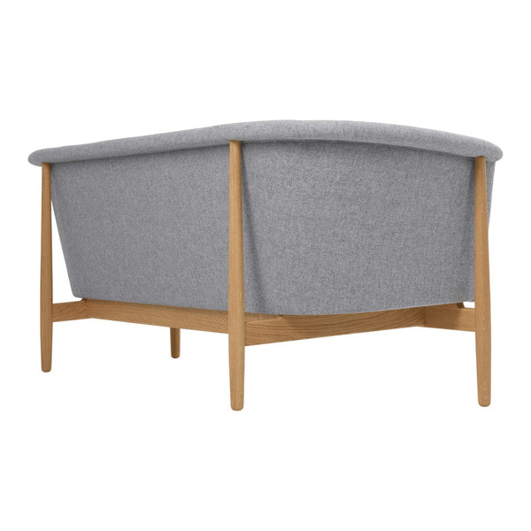 Gray upholstered sofa with smooth lines and natural wood legs, featuring a minimalist, modern design.
