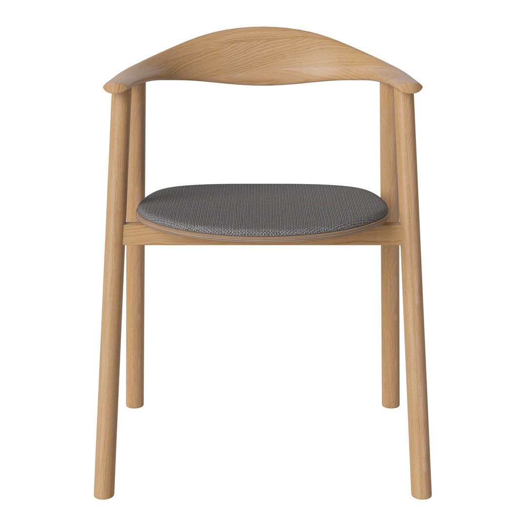 Light wood chair with a curved back and a gray upholstered seat, showcasing a minimalist design and neutral color palette.