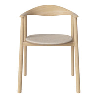 Light wood chair with curved backrest and soft beige fabric seat, showcasing a minimalist design.