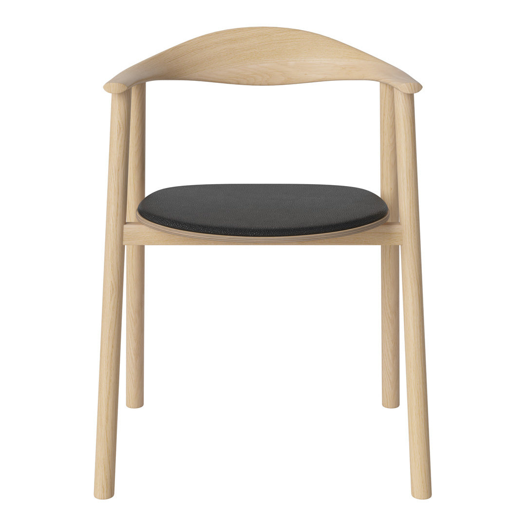 Light wood chair with a smooth, natural finish and a sleek black cushion seat. Minimalist design and modern appeal.