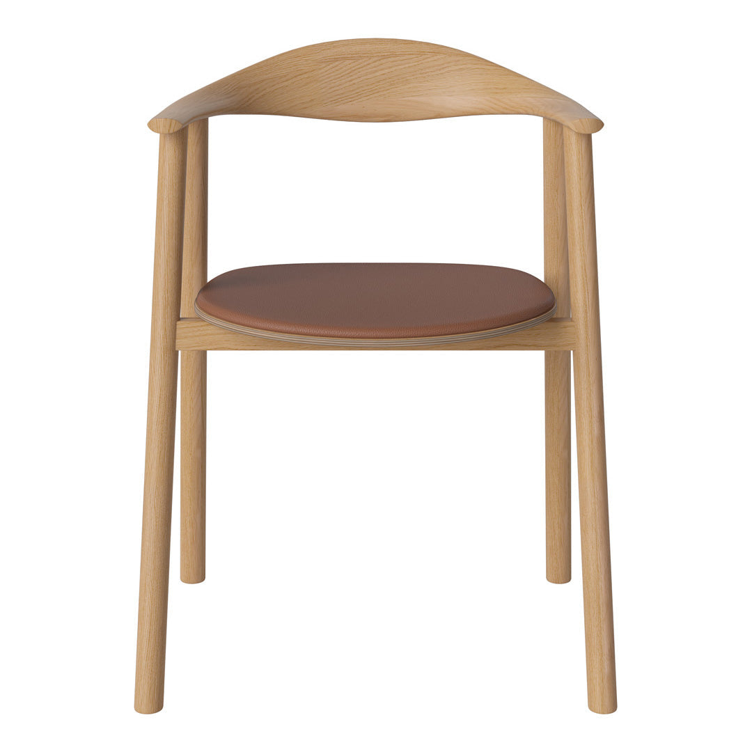 Light wood chair with a smooth finish and a round brown leather seat cushion. Minimalist design, natural colors.