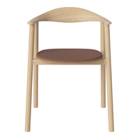 Natural wood chair with a smooth light finish and a warm brown leather seat, showcasing minimalist design and simple elegance.