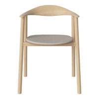 Light wood chair with a curved backrest and a smooth, gray seat, featuring minimalist design and natural tones.