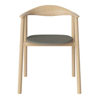 Light wood chair with a smooth finish and a soft gray cushioned seat. Minimalist design and natural tones.