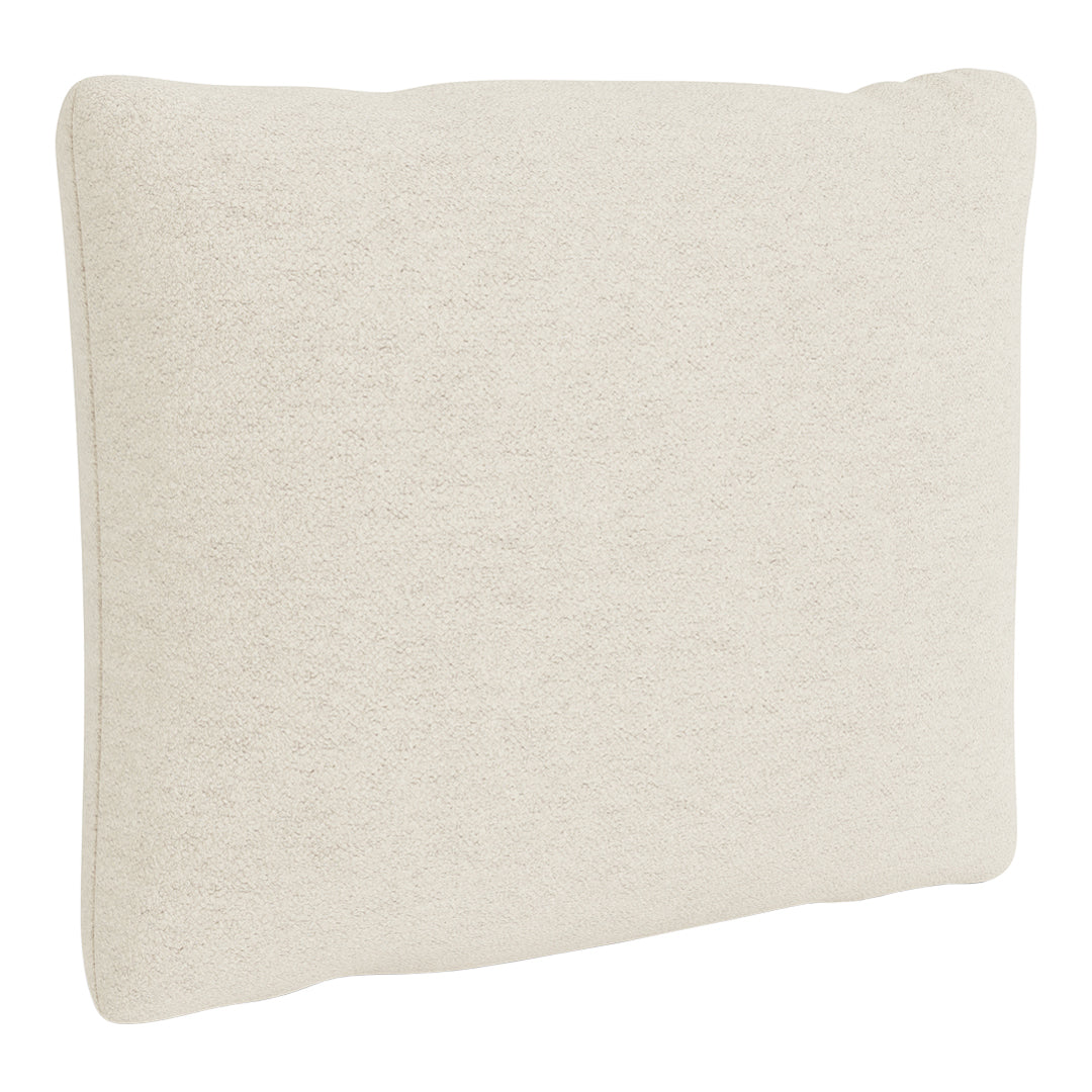 Light beige throw pillow with a soft, textured pattern adds a cozy touch to any decor.