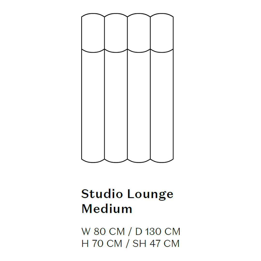 Minimalist medium lounge in soft neutral tones and smooth, cylindrical patterns for a sleek, modern aesthetic.