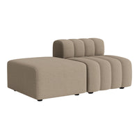 Beige modular sofa with a smooth, textured pattern and rounded edges, perfect for modern living spaces.