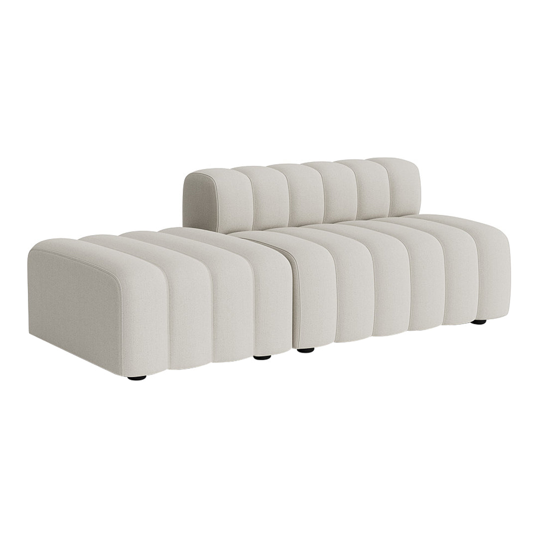 Modern cream sofa with a sleek, ribbed pattern and a contemporary design. Perfect for stylish living spaces.