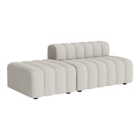 Modern cream sofa with a sleek, ribbed pattern and a contemporary design. Perfect for stylish living spaces.