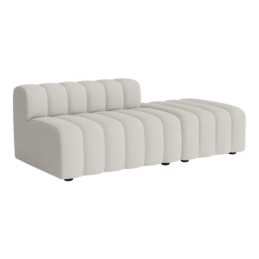 Cream-colored sofa featuring a modern ribbed design with soft curves and clean lines.