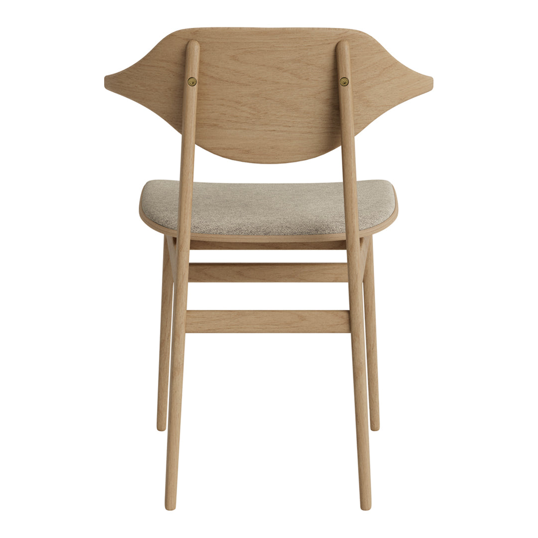 Light oak wood chair with a cream fabric seat, featuring a unique curved back design. Perfect for modern decor.