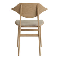 Light oak wood chair with a cream fabric seat, featuring a unique curved back design. Perfect for modern decor.