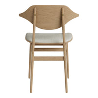 Natural wood chair with a light beige cushion and elegant curved back design, showcasing a minimalist style.