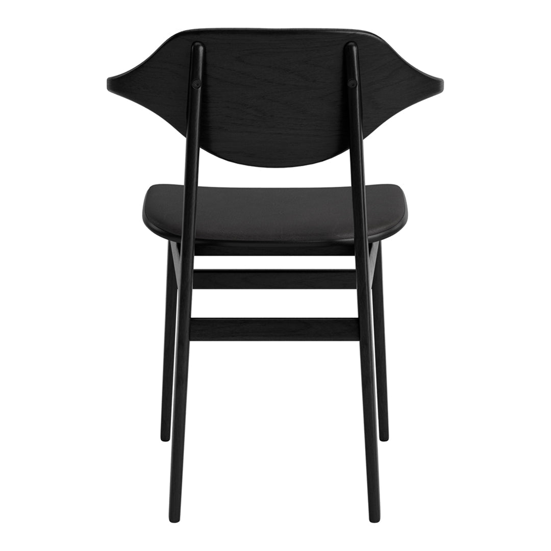 Black wooden chair with a minimalist design and smooth finish, featuring subtle curves and a sleek silhouette.