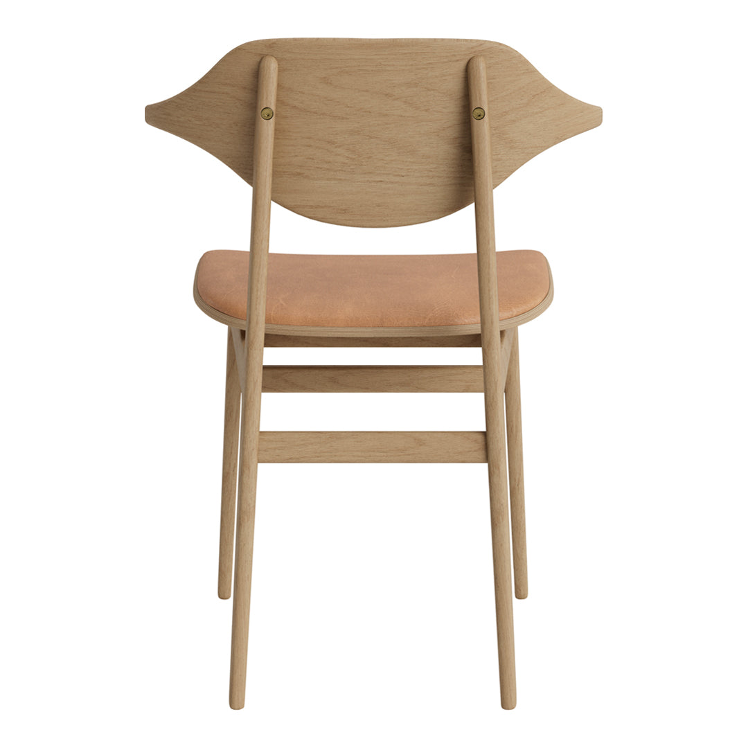 Light wood chair with a smooth beige seat and an elegant curved backrest design. Modern and minimalistic style.