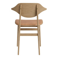 Light wood chair with a smooth beige seat and an elegant curved backrest design. Modern and minimalistic style.