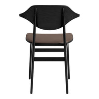 Black wooden chair with a curved backrest and brown upholstered seat, showcasing a sleek, modern design.