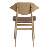 Natural wood color chair with a smooth, dark brown seat and a unique leaf-shaped backrest design.