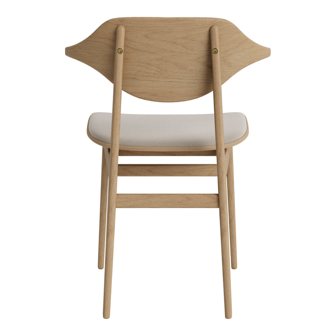 Light oak folding chair with a simple, curved backrest and a neutral upholstered seat.