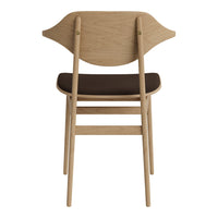 Light oak chair with a curved backrest and dark brown seat cushion, showcasing a modern, minimalist design.