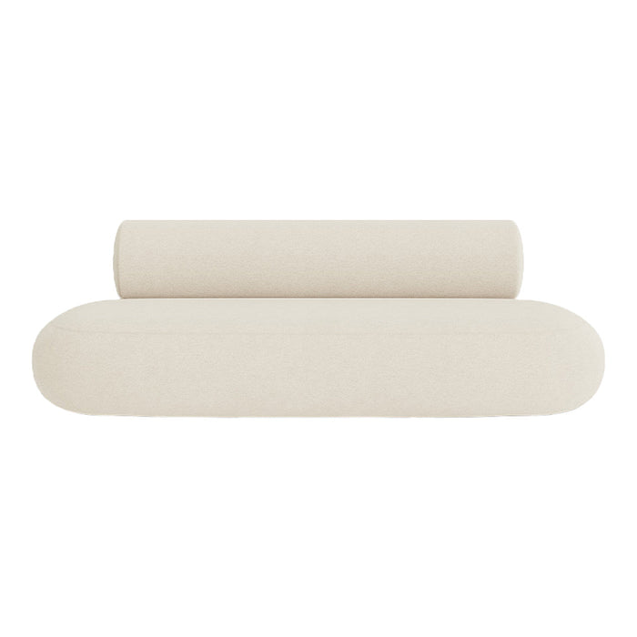 Beige minimalist sofa cushion with a smooth texture, featuring rounded edges and a cylindrical bolster.