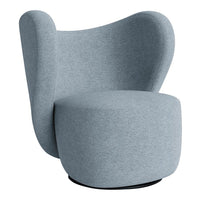 Soft blue accent chair with a modern, curved design and textured fabric. Ideal for contemporary decor.