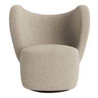 Beige contemporary armchair with a smooth, textured fabric and rounded design, perfect for modern interiors.