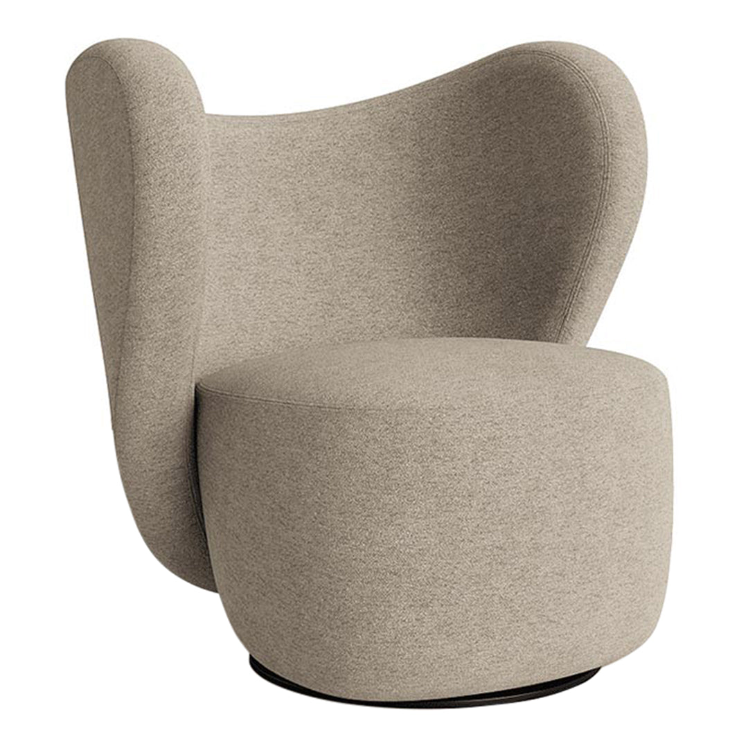 Stylish cream-colored chair with a smooth, textured fabric and distinctive sculptural shape.