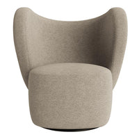 Beige upholstered chair with a smooth, rounded design and soft texture, perfect for modern decor.