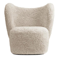 Cozy cream-colored chair with a textured, fluffy pattern, perfect for modern home decor.