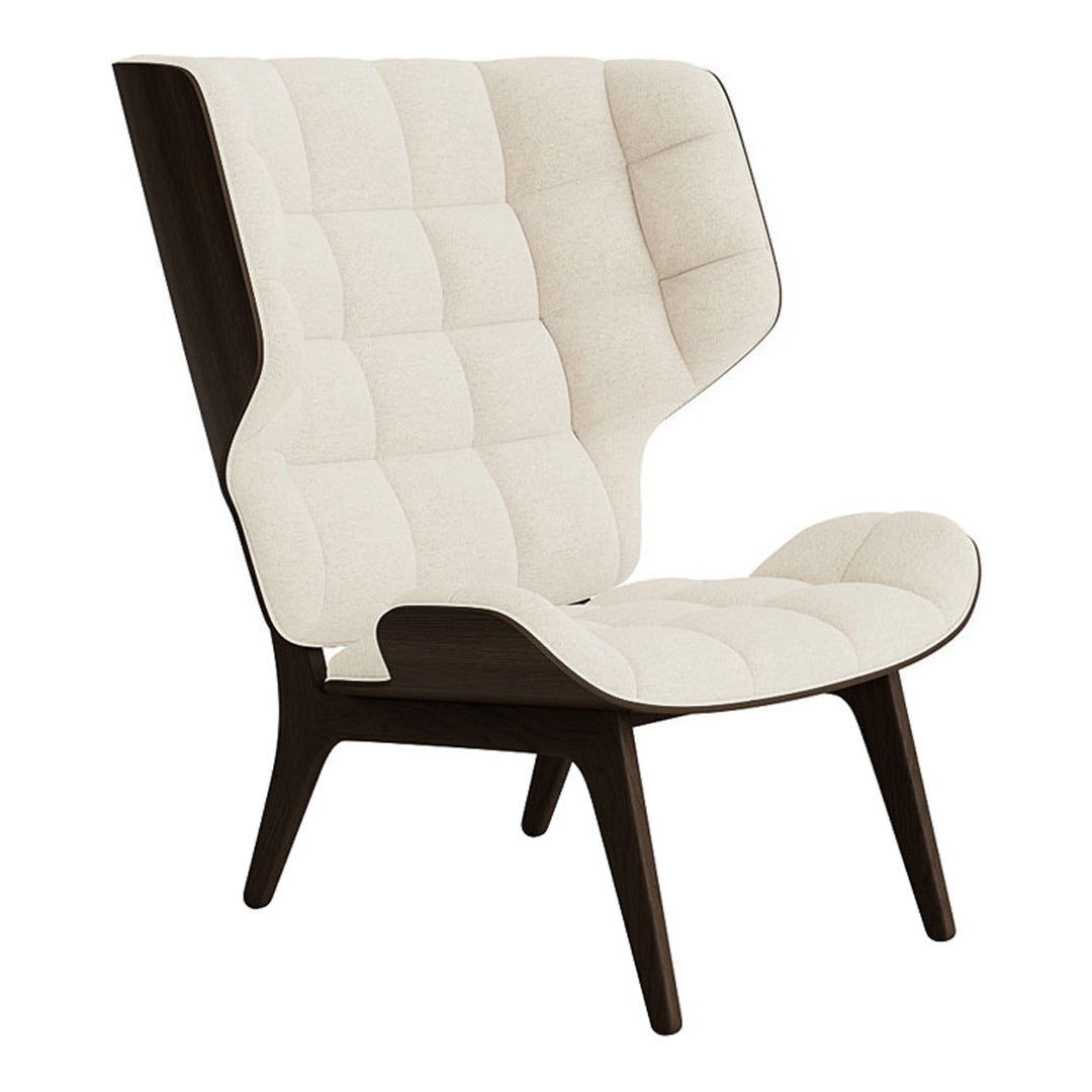 Cream and dark brown upholstered chair with a tufted pattern and sleek, modern design.