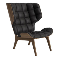 Stylish black tufted chair with a sleek wood frame, featuring a modern design and plush texture. Perfect for any decor.