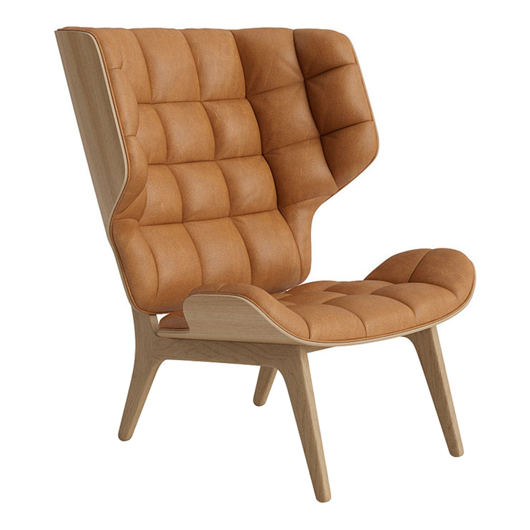 Tan leather armchair with tufted design and natural wood frame, combining modern and cozy aesthetics.