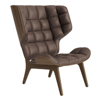 Brown tufted lounge chair with a unique high-back design and wooden legs, showcasing a sleek, modern aesthetic.