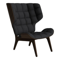 Black tufted chair with a modern design and dark wood frame, perfect for contemporary interiors.